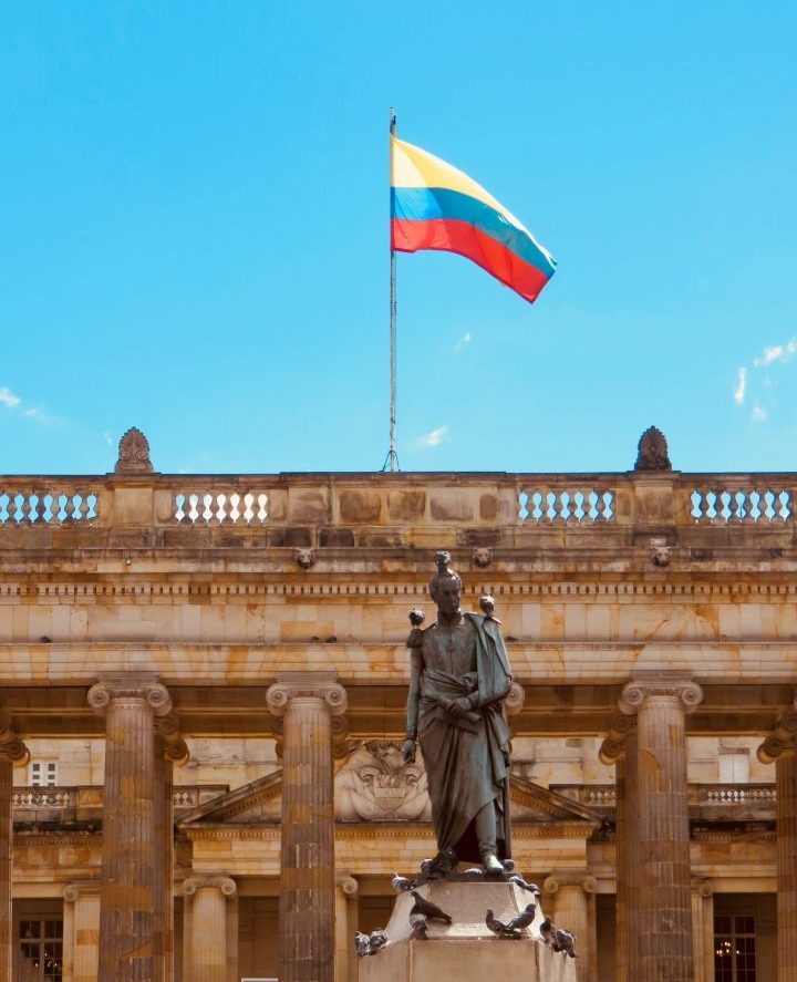 Flag on Plaza Bolivar in Bogota Colombia; Colombia Travel Blog Inspirations