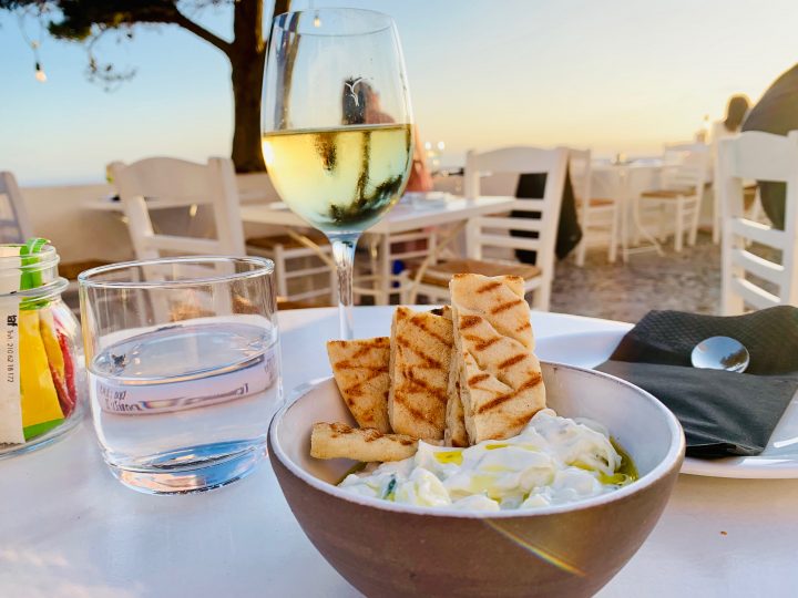 Restaurant bar Volkan drinking Wine on Santorini Greece, Greek Cyclades travel Blog