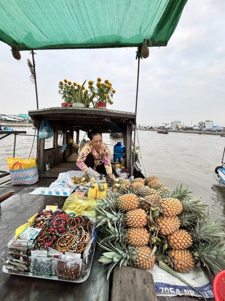 Fresh Pineapple tasting Floating Market Mekong Delta Can Tho Travel Blog Vietnam Asia