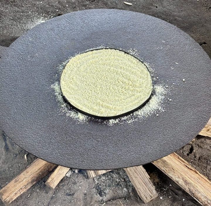 Baking cassava bread during the Seliba tour in Suriname