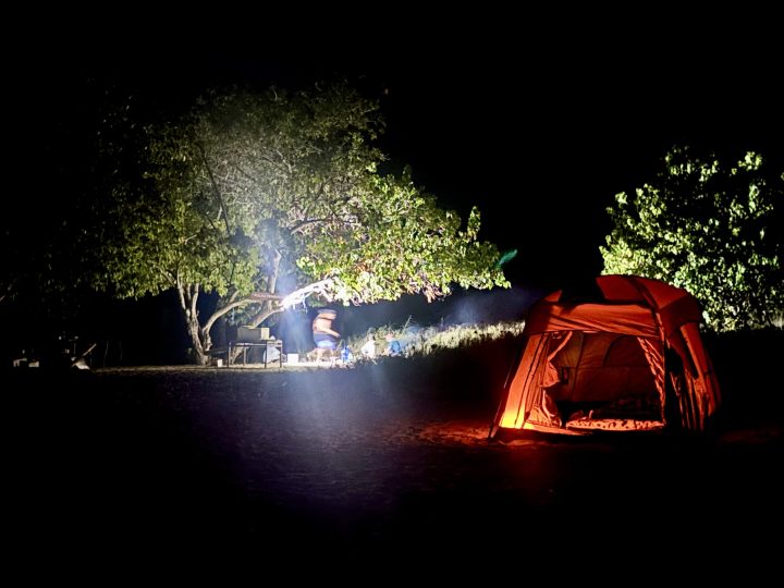 Beach campsite at night on Nusa Bamba in Riung
