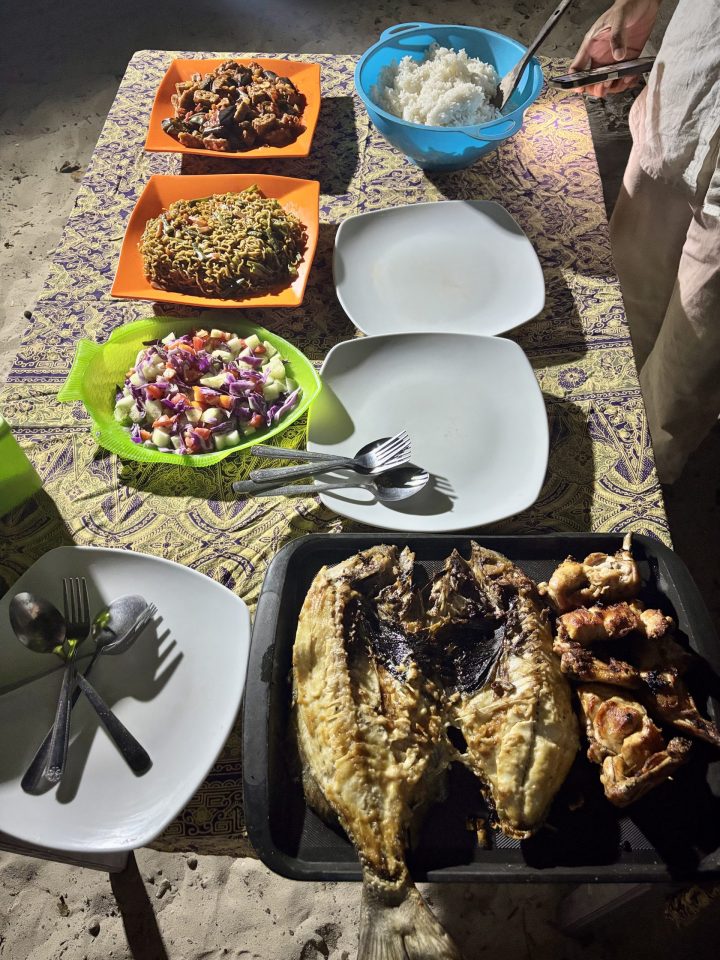 Fresh fish chicken vegetables and rice for dinner on Nusa Bamba