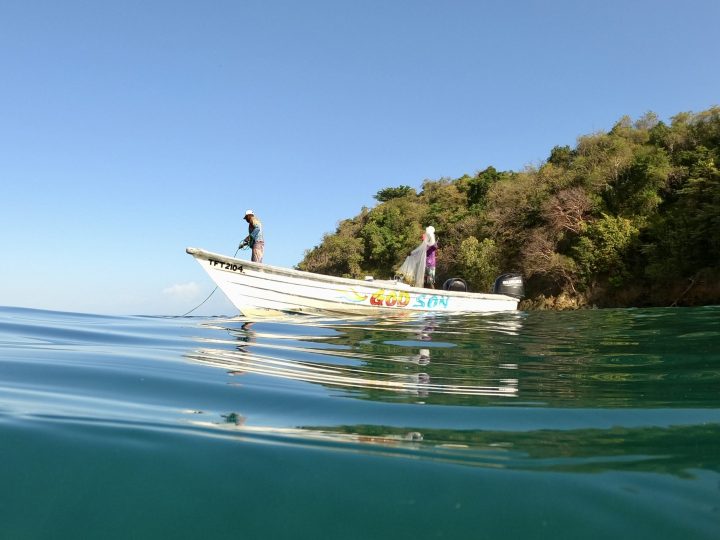 Fisherman on a boat in Castara Tobago