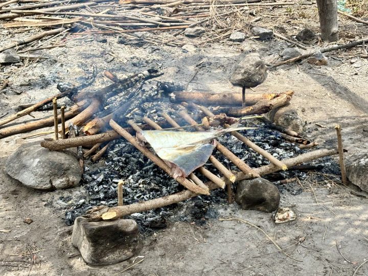 Fresh fish grilling over the fire for lunch on Nusa Tiga