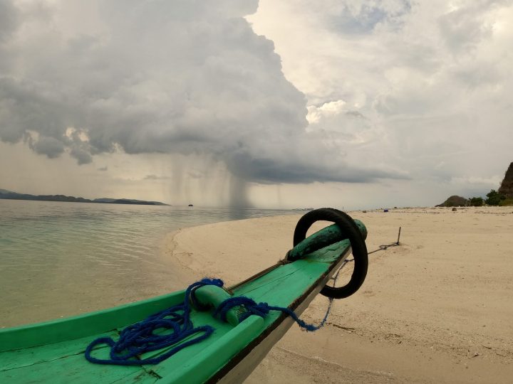 Dark rain cloud over the Flores mountains during the Riung boat trip