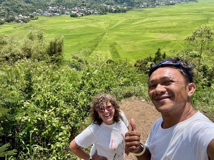 Mirja and driver Iwan at the Cara spider web rice fields near Cancar