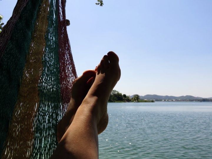 Relaxing in a hammock at Jorge's Rope Swing near Flores Guatemala