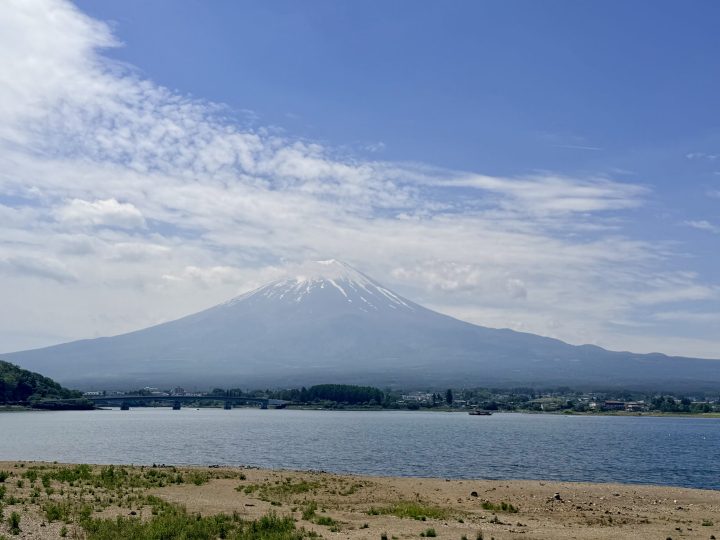 Mt Fuji behind a small beach at Lake Kawaguchi