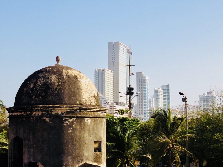 Historic Cartagena walls with modern Bocagrande skyline behind them