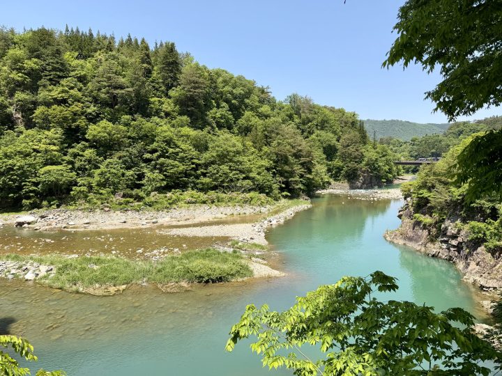 River running through the green valley of Shirakawago