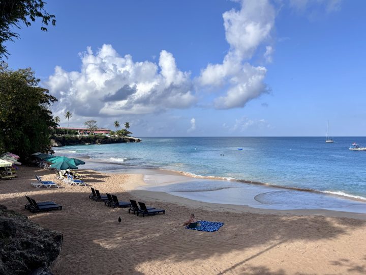 Clear water and swimmers at Store Bay Beach in Tobago