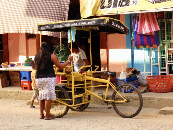 Street vendor selling fruit drinks in Livingston Guatemala