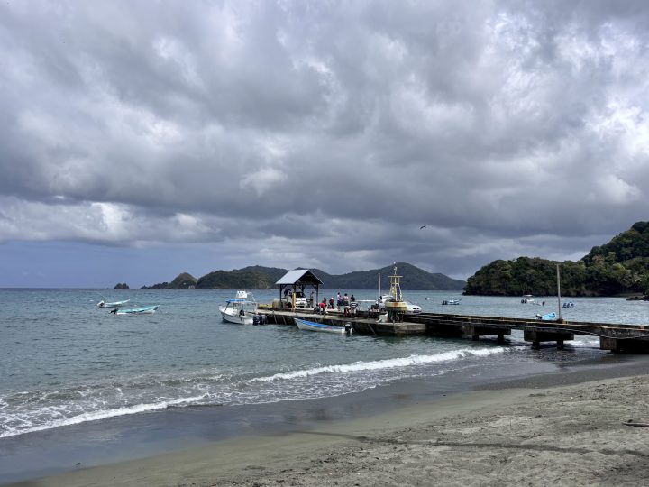 Tyrell's Bay and pier in Speyside Tobago under cloudy skies