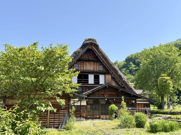 Exterior of Wada House with its steep thatched roof